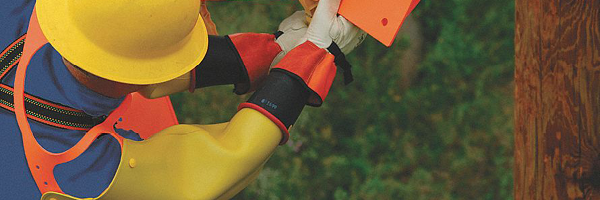 electrical linesman wearing rubber insulating sleeves